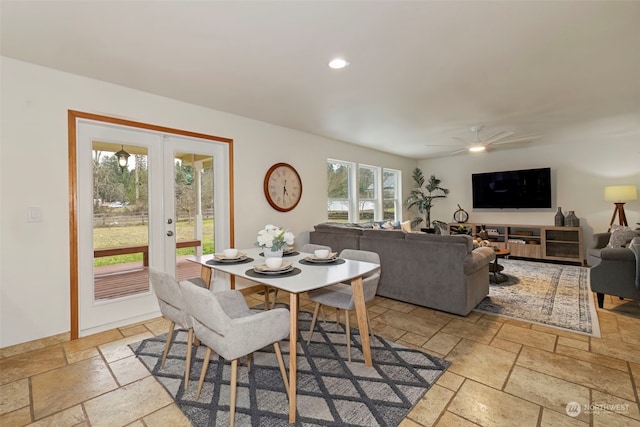 dining room featuring ceiling fan and french doors