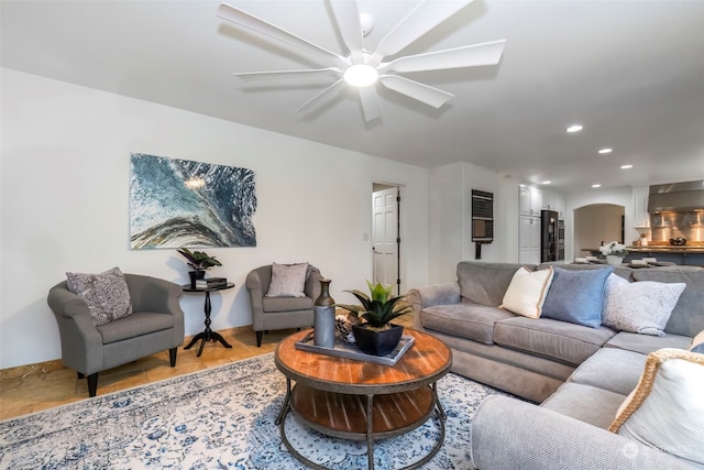 living room featuring ceiling fan and light tile patterned floors