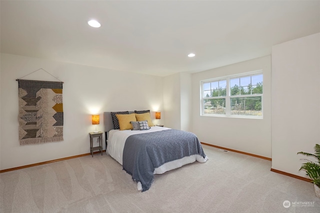 bedroom featuring light carpet