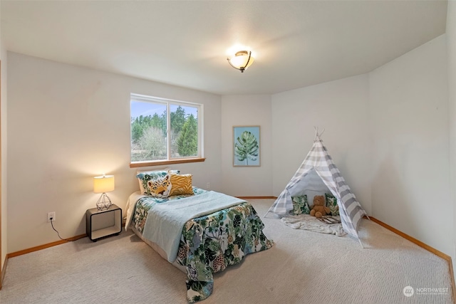 bedroom featuring light carpet