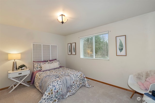 bedroom with light colored carpet