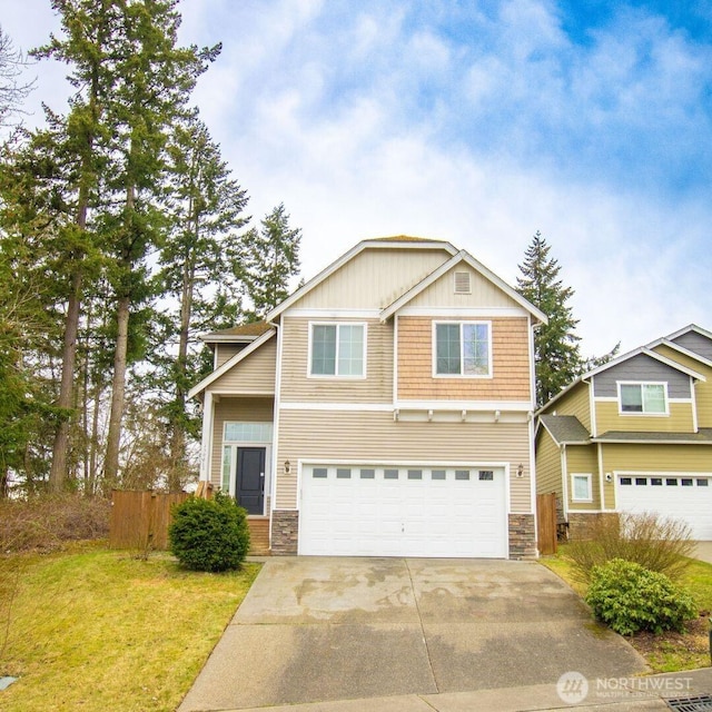 craftsman inspired home with stone siding, concrete driveway, a garage, and fence