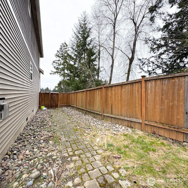 view of yard with a patio and a fenced backyard