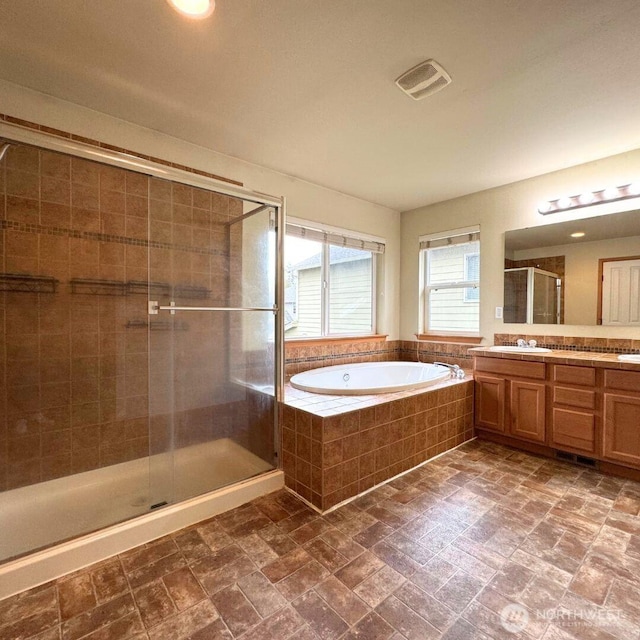 full bath featuring visible vents, a garden tub, a stall shower, and vanity