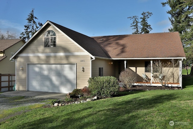 view of front facade featuring a front yard and a garage