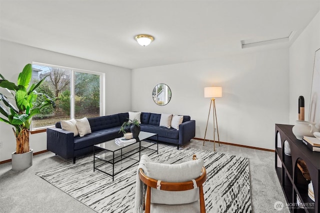 carpeted living room featuring baseboards