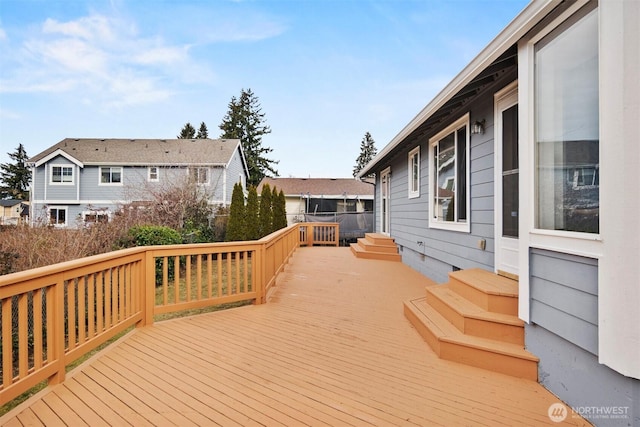 wooden terrace featuring a residential view