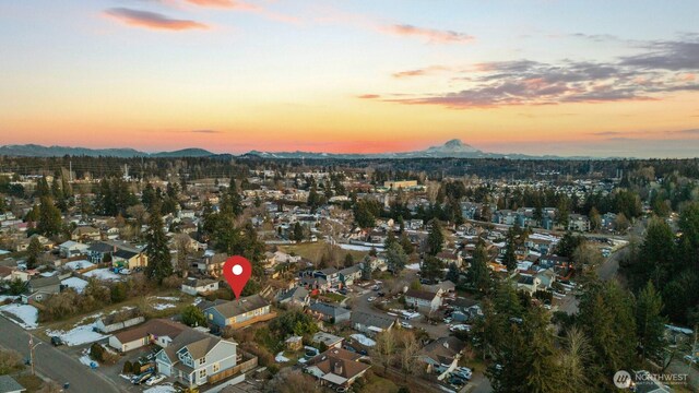 aerial view at dusk with a residential view and a mountain view