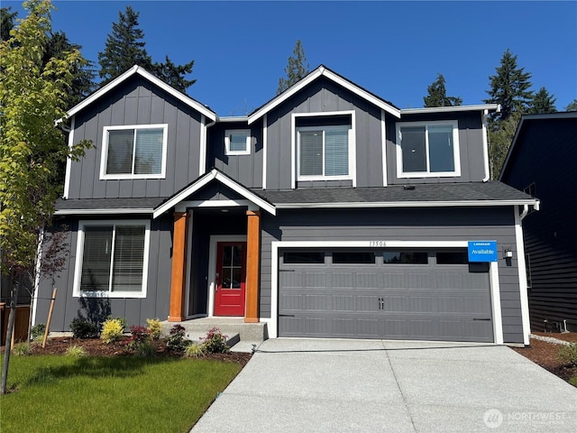 13506 62nd Pl W, Edmonds, WA 98026 - view of front of property with a garage, board and batten siding, driveway, and a front yard