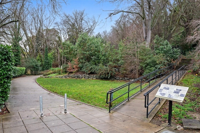 view of home's community featuring a lawn