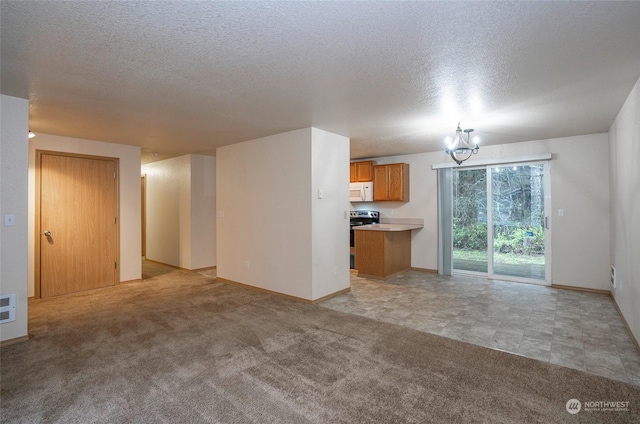 unfurnished living room featuring a chandelier and light colored carpet