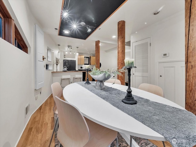 dining area featuring light hardwood / wood-style floors