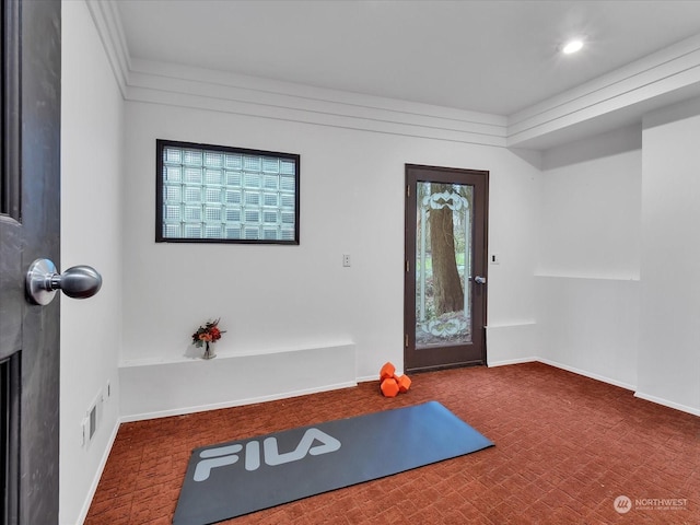 workout area with dark colored carpet