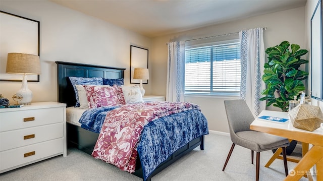 bedroom featuring light colored carpet