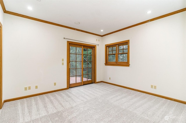 carpeted spare room with ornamental molding