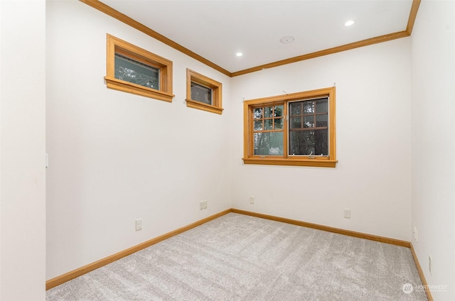 unfurnished room with light colored carpet and ornamental molding