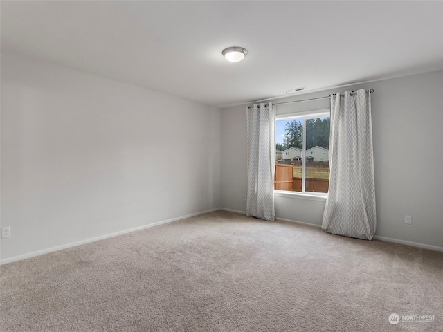 view of carpeted spare room