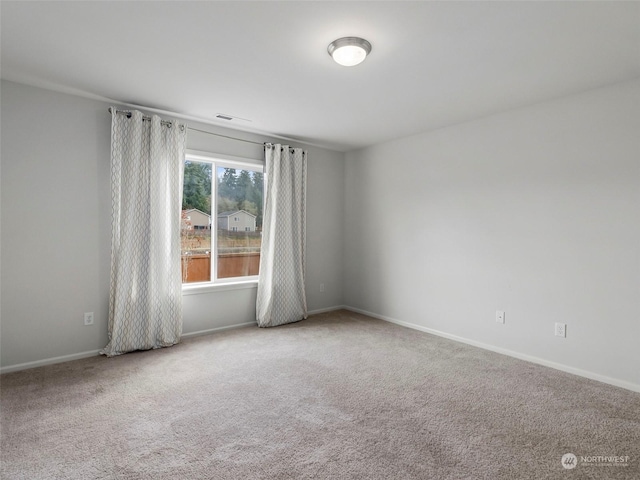 unfurnished room featuring carpet flooring