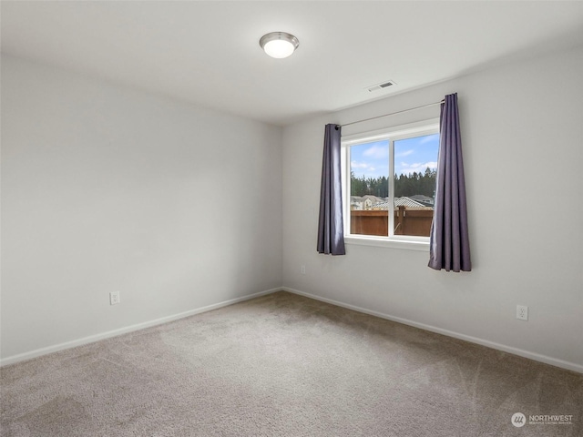 unfurnished room with carpet floors