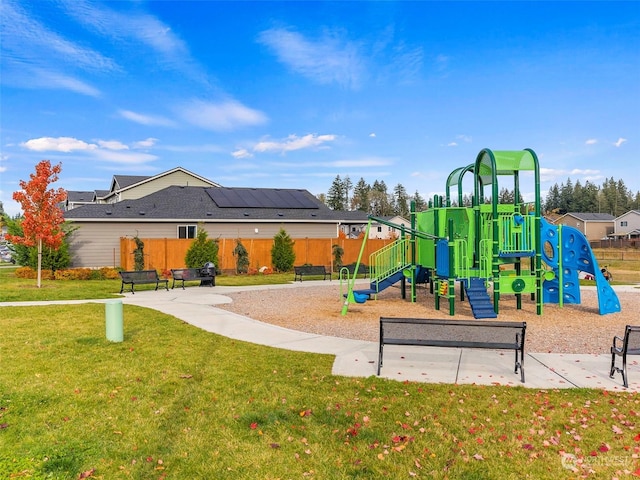 view of jungle gym featuring a lawn