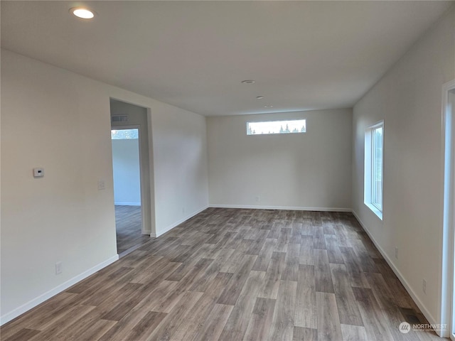 unfurnished room featuring wood-type flooring