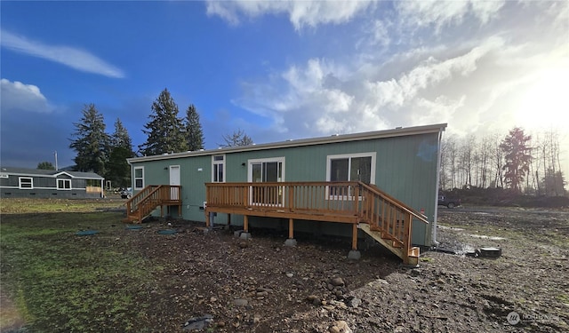 53 Newton Rd, Forks, WA 98331 - back of property with stairs and a wooden deck