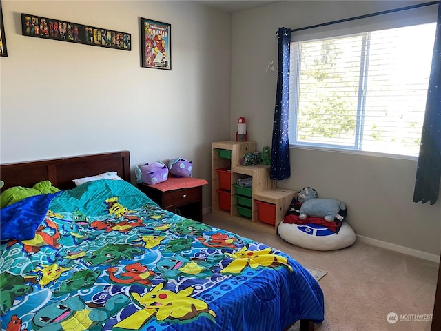 bedroom with carpet flooring and multiple windows