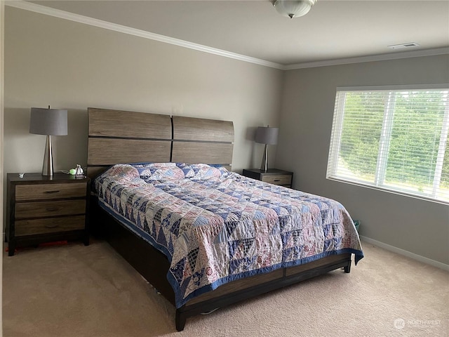 bedroom featuring light colored carpet and ornamental molding