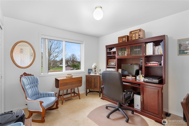office area with baseboards and light colored carpet