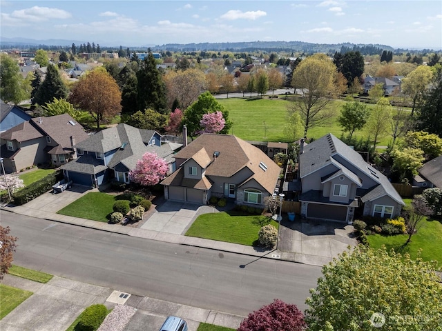 birds eye view of property with a residential view