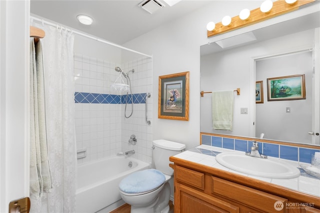 full bathroom featuring toilet, visible vents, shower / bath combo, and vanity