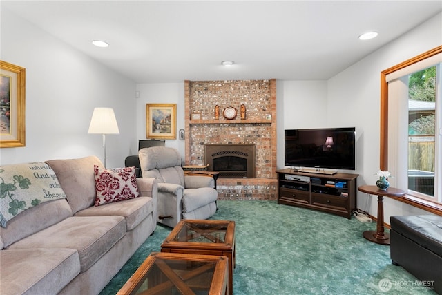 carpeted living area featuring recessed lighting and a fireplace
