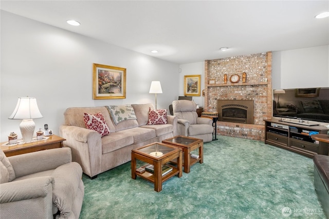 living room with recessed lighting, carpet, and a fireplace