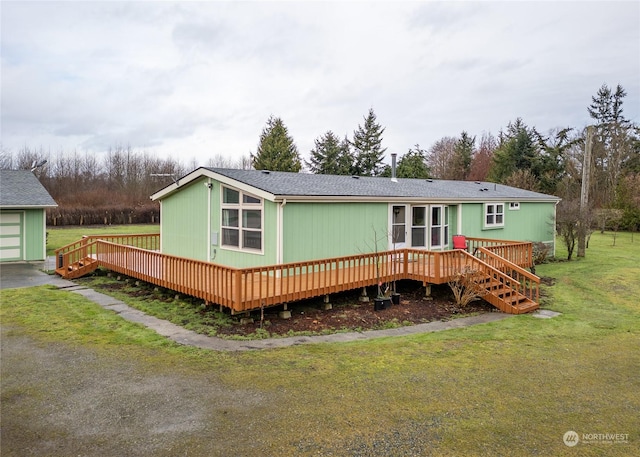 4495 Sequim Dungeness Way, Sequim, WA 98382 - rear view of house with a deck and a lawn