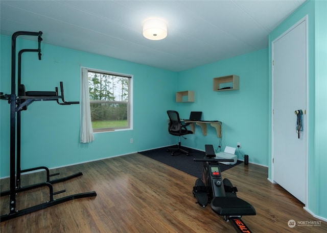 exercise area with dark wood-type flooring