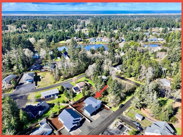 109 Sunrise Ave SE, Ocean Shores, WA 98569 - aerial view of property's location with a nearby body of water, a forest, and nearby suburban area