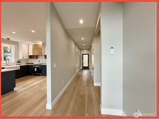 109 Sunrise Ave SE, Ocean Shores, WA 98569 - corridor with light wood-style floors, baseboards, and recessed lighting