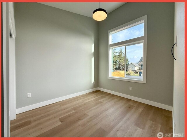 109 Sunrise Ave SE, Ocean Shores, WA 98569 - empty room with wood finished floors and baseboards