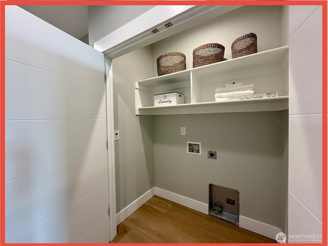 109 Sunrise Ave SE, Ocean Shores, WA 98569 - laundry area with wood finished floors, baseboards, electric dryer hookup, and hookup for a washing machine