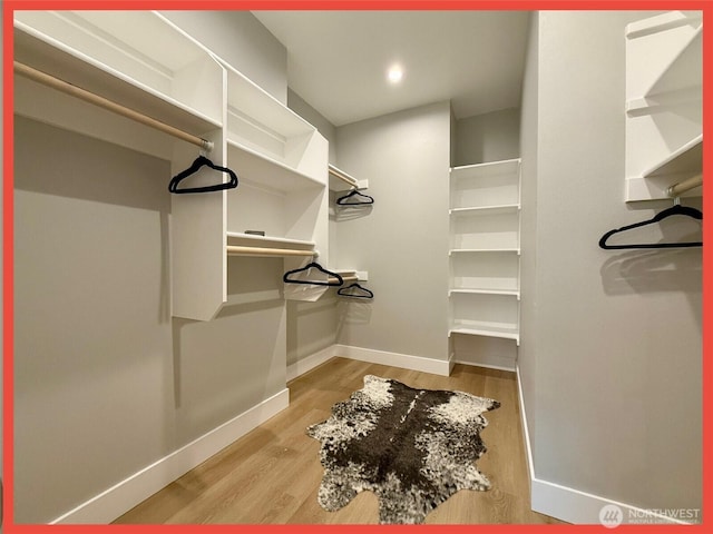 109 Sunrise Ave SE, Ocean Shores, WA 98569 - walk in closet featuring wood finished floors