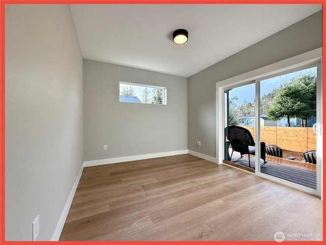 109 Sunrise Ave SE, Ocean Shores, WA 98569 - empty room with healthy amount of natural light, light wood-style floors, and baseboards