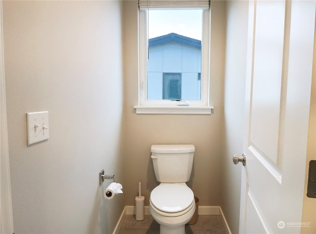 bathroom featuring toilet and tile patterned floors