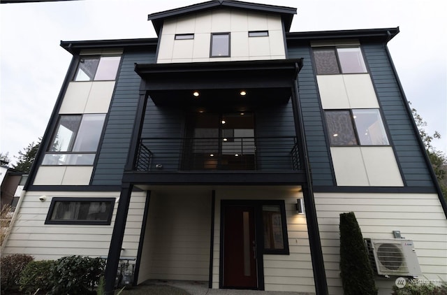 exterior space featuring a balcony and ac unit