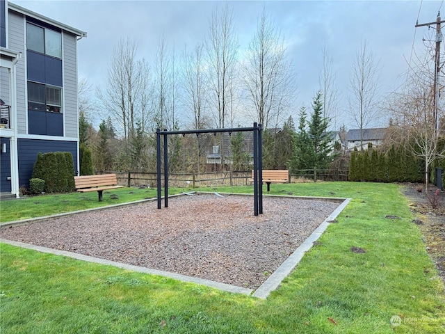 view of playground with a lawn