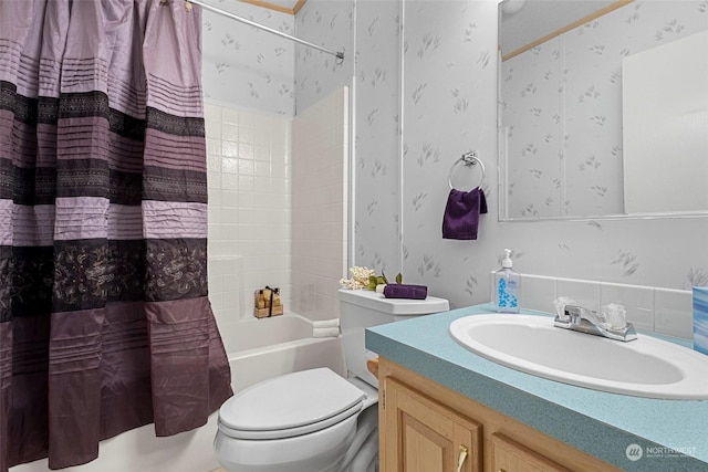 full bathroom featuring toilet, vanity, and shower / tub combo with curtain