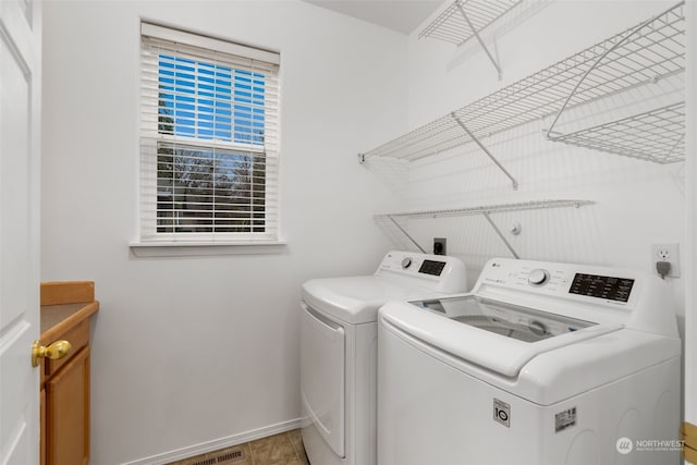 laundry area featuring washing machine and clothes dryer