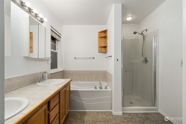 bathroom with tile patterned flooring, vanity, and plus walk in shower