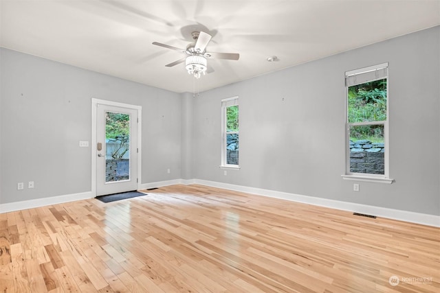 unfurnished room featuring ceiling fan and light wood-type flooring