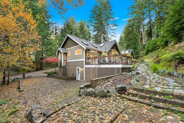 view of side of property featuring a deck