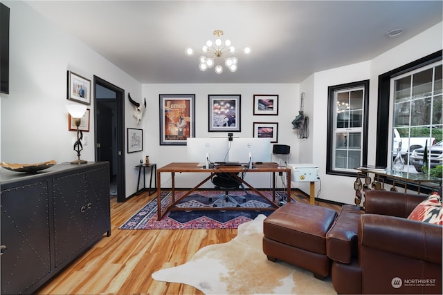 office featuring hardwood / wood-style flooring and an inviting chandelier